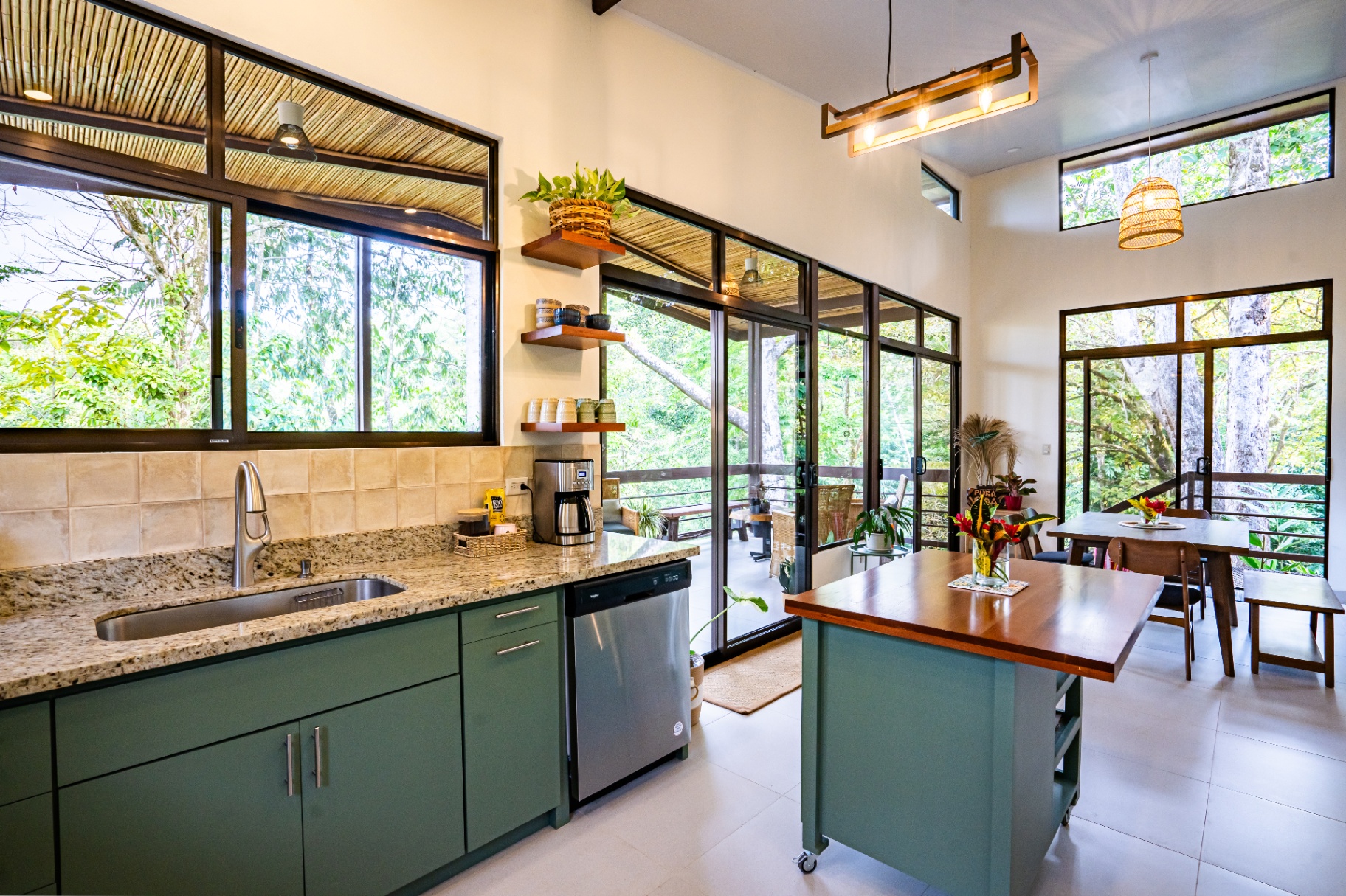Dining area beside the open kitchen at Casa Aluem